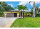 Single-Gathering home with two-car garage and palm trees at 251 Plantation Rd, Venice, FL 34293