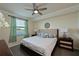 Spacious main bedroom with a king-size bed and large window offering a scenic view at 6515 Grand Estuary Trl # 105, Bradenton, FL 34212