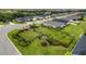 Aerial view of a residential neighborhood with a community dog park at 7434 35Th E Ln, Sarasota, FL 34243