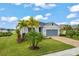 Single-story home with gray siding and two-car garage at 7434 35Th E Ln, Sarasota, FL 34243
