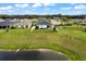 Aerial view showcasing the home's location near a pond at 7434 35Th E Ln, Sarasota, FL 34243