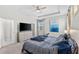Main bedroom with large bed, TV, and plenty of closet space at 7434 35Th E Ln, Sarasota, FL 34243