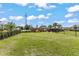 Community dog park with fenced area and benches at 7434 35Th E Ln, Sarasota, FL 34243