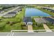 Aerial view of a home near a pond in a residential neighborhood at 7434 35Th E Ln, Sarasota, FL 34243