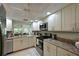 Well-equipped kitchen featuring granite countertops and stainless steel appliances at 6503 Stone River Rd # 302, Bradenton, FL 34203