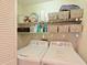 Laundry room with washer, dryer, and shelving at 6503 Stone River Rd # 302, Bradenton, FL 34203