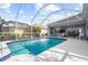 Enjoy this relaxing pool and patio area with plenty of seating at 5207 Pine Shadow Ln, North Port, FL 34287