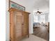 View of bedroom from hallway with wooden cabinet at 5207 Pine Shadow Ln, North Port, FL 34287