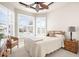 Bedroom with a queen-size bed, ample natural light and plantation shutters at 5207 Pine Shadow Ln, North Port, FL 34287