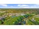 Aerial view of community with lake and golf course at 5207 Pine Shadow Ln, North Port, FL 34287