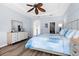 Spacious Primary bedroom with large bed and ample closet space at 5207 Pine Shadow Ln, North Port, FL 34287