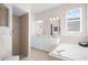 Elegant bathroom with double sinks and a jetted tub at 5207 Pine Shadow Ln, North Port, FL 34287