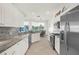 Updated kitchen with granite countertops, stainless steel appliances, and a view at 5207 Pine Shadow Ln, North Port, FL 34287