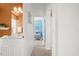 Bright hallway with access to bedroom and bathroom at 5207 Pine Shadow Ln, North Port, FL 34287