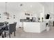 Eat-in kitchen with breakfast bar and modern finishes at 5207 Pine Shadow Ln, North Port, FL 34287