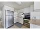 Stainless steel appliances and light wood cabinets in this kitchen at 718 50Th Avenue W Dr, Bradenton, FL 34207