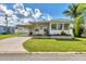 Charming single-story home with a carport and well-maintained lawn at 718 50Th Avenue W Dr, Bradenton, FL 34207
