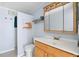 Clean bathroom with light wood vanity and shower at 718 50Th Avenue W Dr, Bradenton, FL 34207
