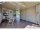 Covered patio with table and chairs and exterior storage at 718 50Th Avenue W Dr, Bradenton, FL 34207