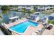 Community pool with surrounding lounge chairs and patio at 718 50Th Avenue W Dr, Bradenton, FL 34207