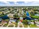 Wonderful home on a canal with mature trees, lush lawns, and a circular driveway at 21288 Edgewater Dr, Port Charlotte, FL 33952