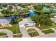 A charming home on the water with a well-kept lawn and attractive landscaping at 21288 Edgewater Dr, Port Charlotte, FL 33952