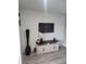 Stylish living room features a flat-screen TV mounted on a shiplap wall, with modern decor at 4629 Sabal Key Dr # 4629, Bradenton, FL 34203