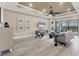 Open and airy living room with high ceilings, a neutral color palette, and lots of natural light at 7020 Whittlebury Trl, Lakewood Ranch, FL 34202