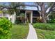 Two story building with landscaping and walkway at 752 White Pine Tree Rd # 206, Venice, FL 34285