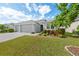 Three-car garage and nicely landscaped yard at 12015 Goldenrod Ave, Bradenton, FL 34212