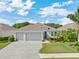 Three-car garage and well maintained landscaping at 12015 Goldenrod Ave, Bradenton, FL 34212