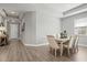 Elegant dining room with light wood table and six upholstered chairs at 904 Whimbrel Run, Bradenton, FL 34212