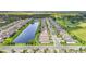 Aerial view of a new Florida community with lake and conservation at 904 Whimbrel Run, Bradenton, FL 34212