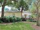 Luxury home with landscaping and palm trees at 5658 Downham Meadows, Sarasota, FL 34235