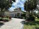 Luxury home with circular driveway and landscaping at 5658 Downham Meadows, Sarasota, FL 34235