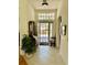 Inviting entryway with tile flooring and a view to the backyard at 5658 Downham Meadows, Sarasota, FL 34235