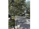 Residential street lined with lush trees at 5658 Downham Meadows, Sarasota, FL 34235