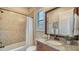 Updated bathroom with granite vanity and a shower/tub combo at 14717 Leopard Creek Pl, Lakewood Ranch, FL 34202