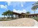 Attractive community clubhouse entrance with landscaping at 14717 Leopard Creek Pl, Lakewood Ranch, FL 34202
