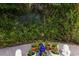 Landscaped backyard with seating area and fountain at 1922 Field Rd, Sarasota, FL 34231