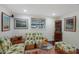 Cozy sitting area with unique pineapple print furniture and built-in shelving at 1922 Field Rd, Sarasota, FL 34231