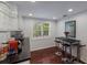 Modern kitchen with white shaker cabinets, black countertops, and breakfast bar at 1922 Field Rd, Sarasota, FL 34231