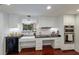 Modern kitchen with white cabinets, black countertops, and built-in appliances at 1922 Field Rd, Sarasota, FL 34231