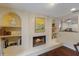 Fireplace with built-in shelving and artwork at 1922 Field Rd, Sarasota, FL 34231