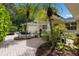 Brick paved courtyard with tropical landscaping at 1922 Field Rd, Sarasota, FL 34231