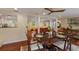Dining room with hardwood floors and view into living room at 1922 Field Rd, Sarasota, FL 34231