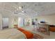 Large bedroom with high ceilings, exposed beams, and en-suite office at 1922 Field Rd, Sarasota, FL 34231