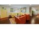 Bright and airy living room with hardwood floors and large windows at 1922 Field Rd, Sarasota, FL 34231