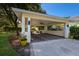 Covered carport with brick pavers and ample parking space at 1922 Field Rd, Sarasota, FL 34231