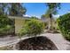 Landscaped yard with brick pavers and lush greenery at 1922 Field Rd, Sarasota, FL 34231